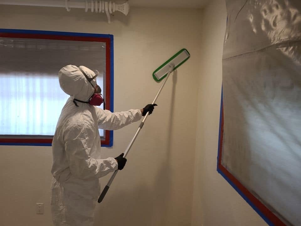 Water damage drying equipment overview in open room with removed flooring
