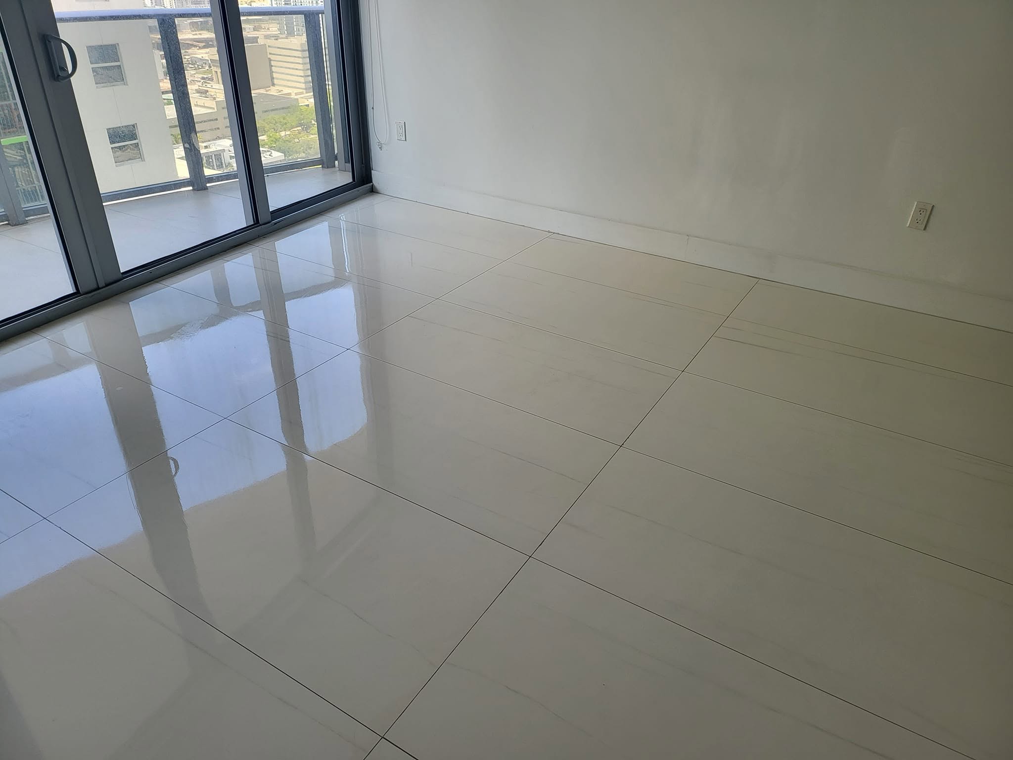 Clean polished tile condo room after completed water damage drying and restoration